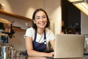 bigstock-Enthusiastic-Asian-Girl-In-Caf-467341295