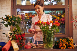 bigstock-Flower-girl-working-with-flowe-79107589