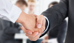 bigstock-Male-And-Female-Handshake-In-O-95155646