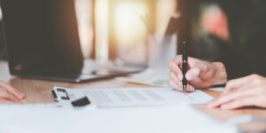 bigstock-Businessman-Checking-Contract-477819395