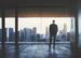 bigstock-Businessman-looking-at-city-59349905