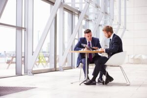 bigstock-Two-business-colleagues-at-mee-101229776-1